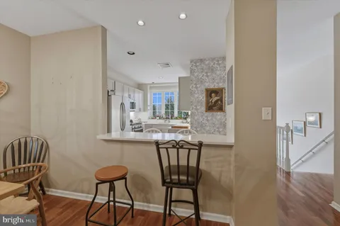 a view of a kitchen and dining room