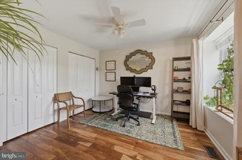 a living room with furniture a rug and a window