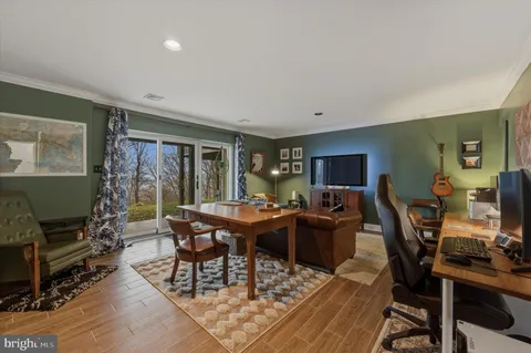 a view of a livingroom with furniture and a flat screen tv