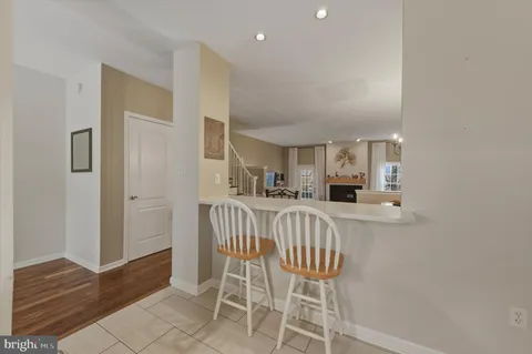 a view of kitchen with furniture and wooden floor