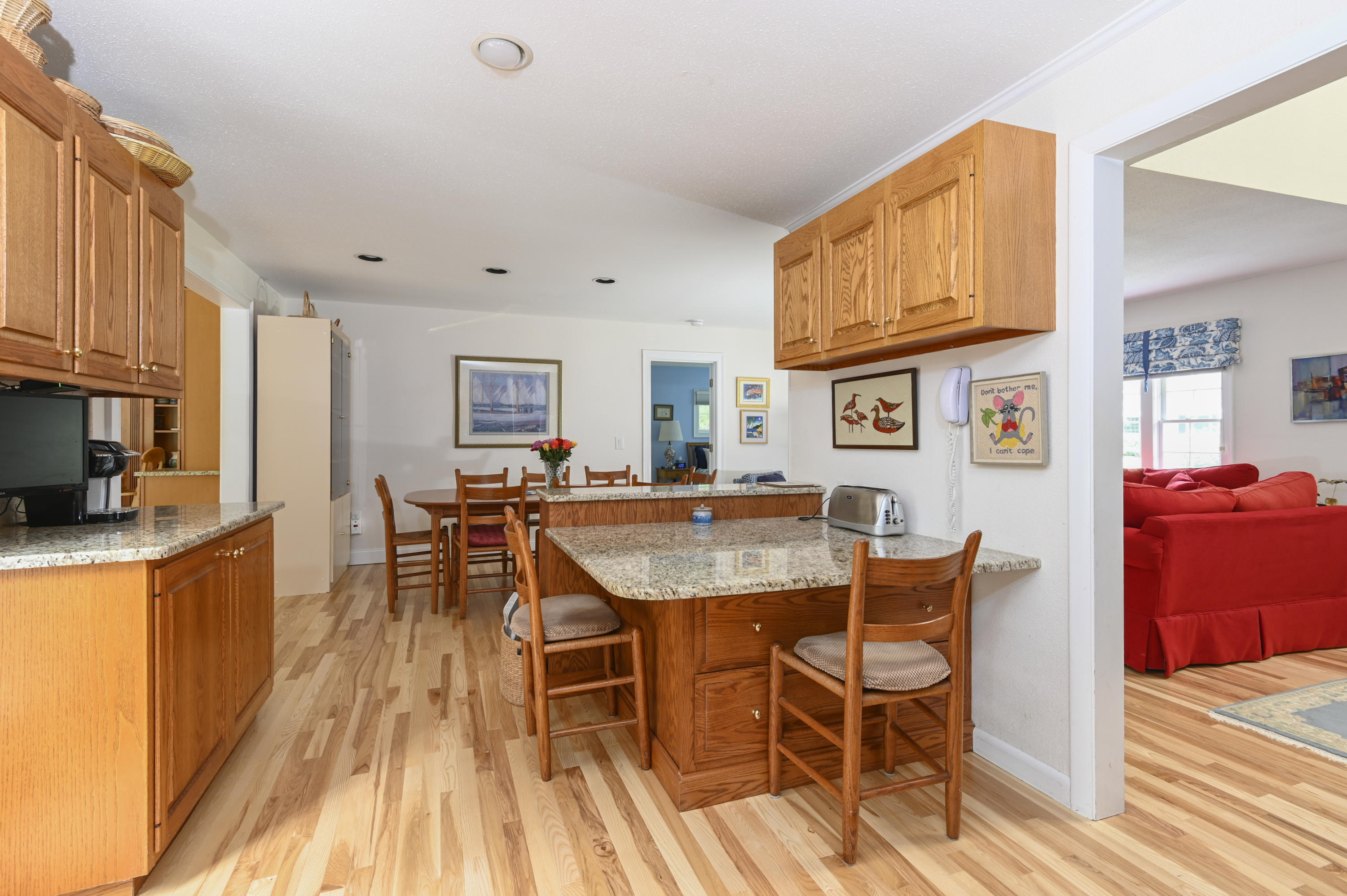95 Wianno Circle Osterville, MA 02655 - Photo 11 of 32 a dining room with furniture and wooden floor