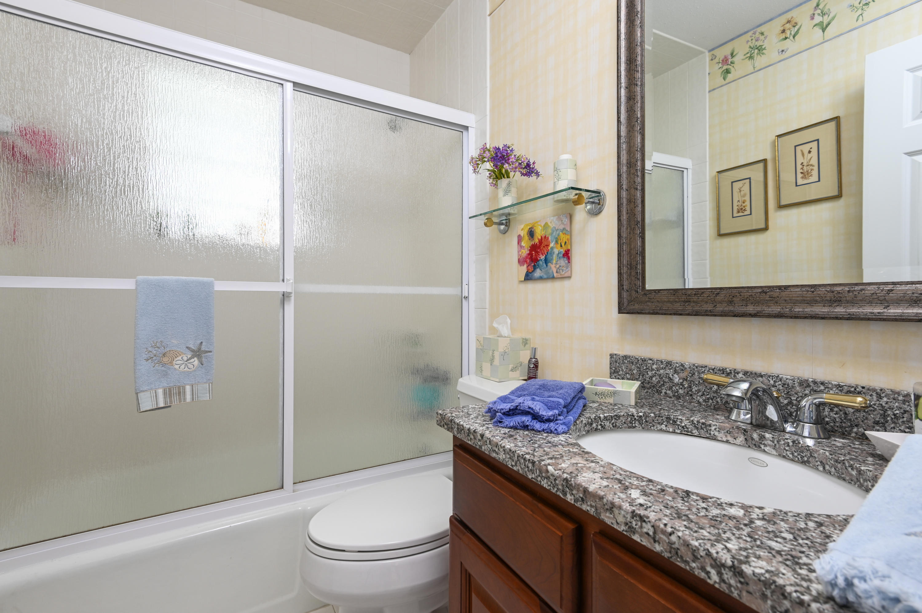 95 Wianno Circle Osterville, MA 02655 - Photo 17 of 32 a bathroom with a granite countertop sink a toilet and shower