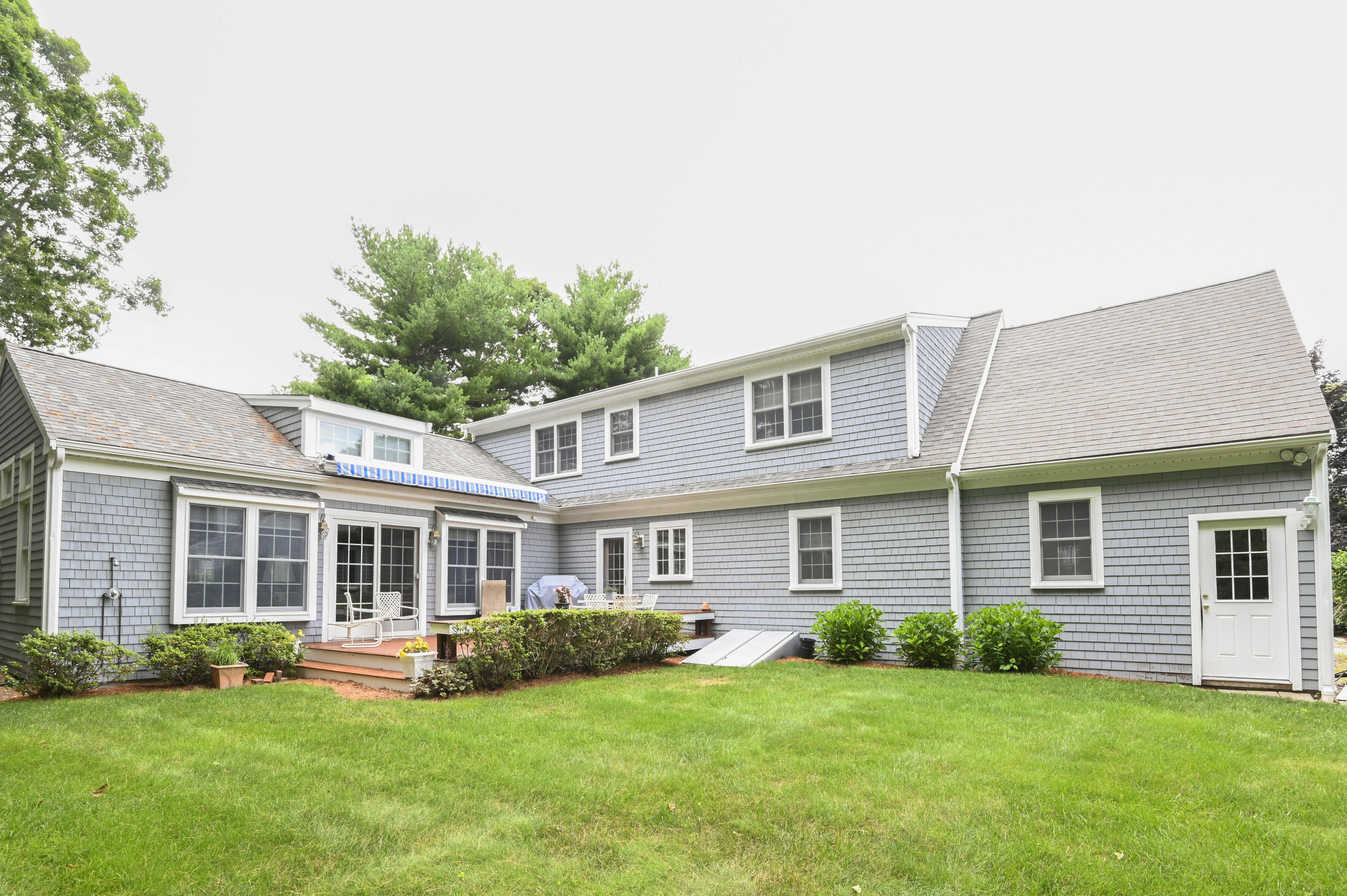 95 Wianno Circle Osterville, MA 02655 - Photo 2 of 32 front view of a house with a yard