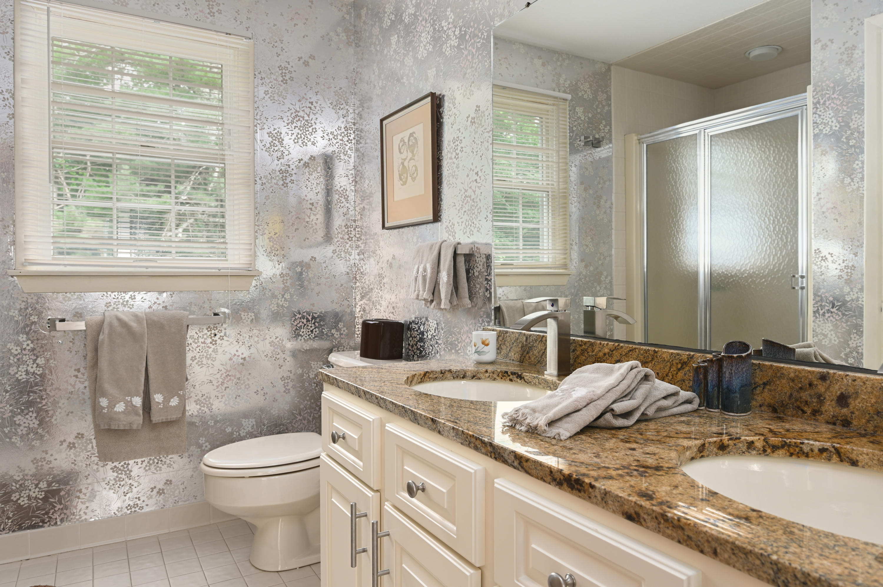95 Wianno Circle Osterville, MA 02655 - Photo 22 of 32 a bathroom with a granite countertop toilet a sink and a mirror