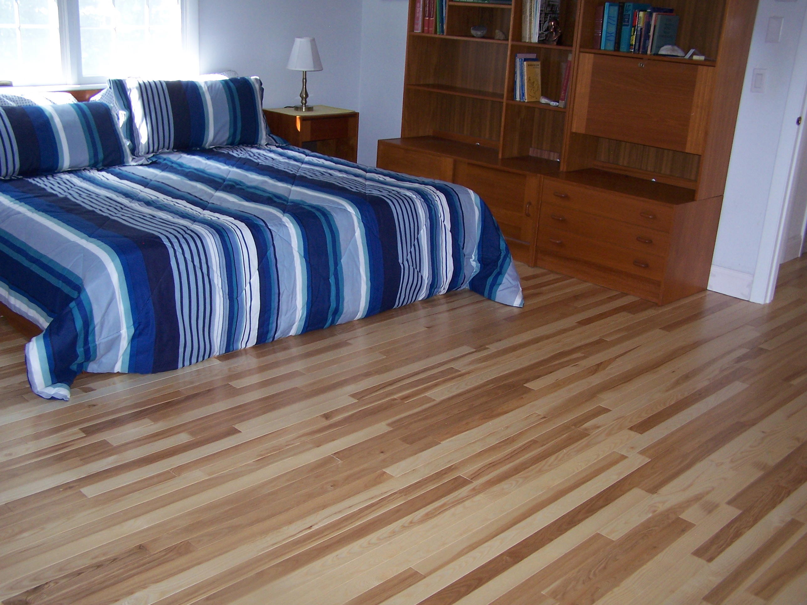 95 Wianno Circle Osterville, MA 02655 - Photo 24 of 32 a bedroom with a bed and wooden floor