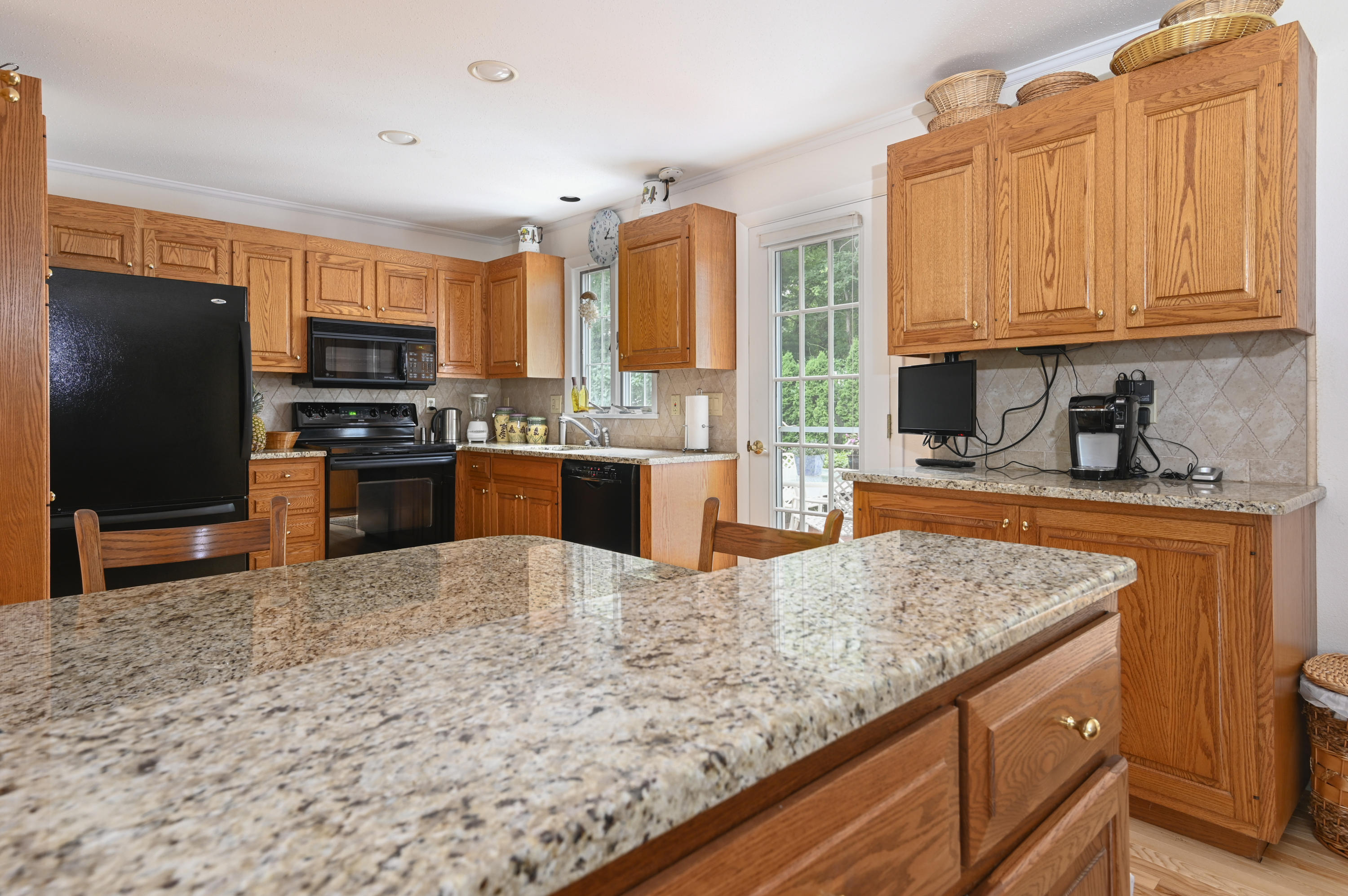 95 Wianno Circle Osterville, MA 02655 - Photo 7 of 32 a kitchen with stainless steel appliances granite countertop a stove refrigerator and a sink