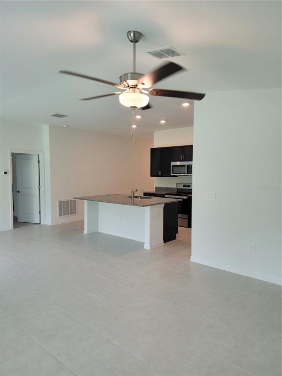 1844 Red Loop Lakeland, FL 33801 - Photo 6 of 24 a view of a kitchen with a sink and dishwasher a kitchen view