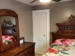 a bedroom with a bed and a dresser