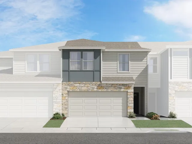 a front view of a house with garage