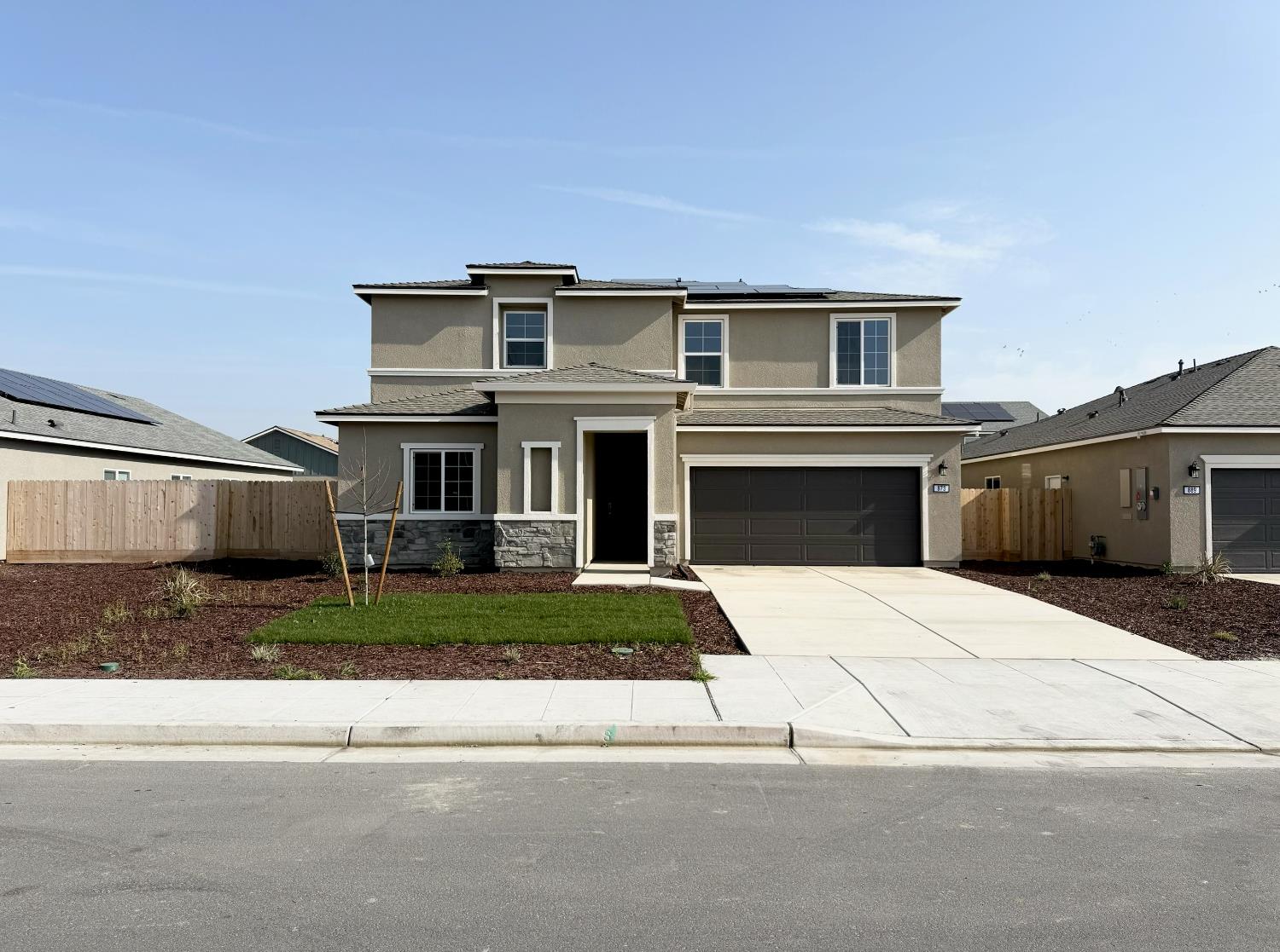 873 South Philip Avenue Fowler, CA 93625 - Photo 1 of 1 a front view of a house with a yard and garage