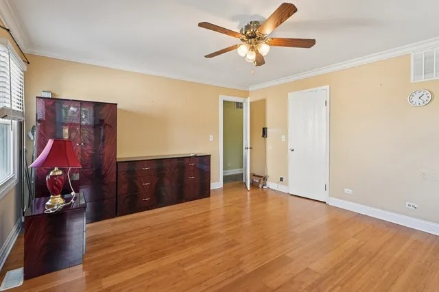 wooden floor in a room with a dresser