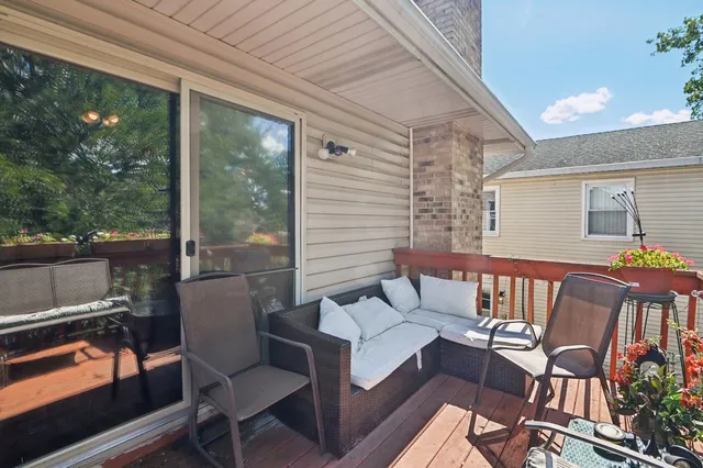a view of two chairs in the balcony
