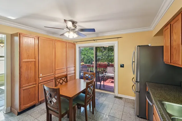 a dining room with furniture window and outside view