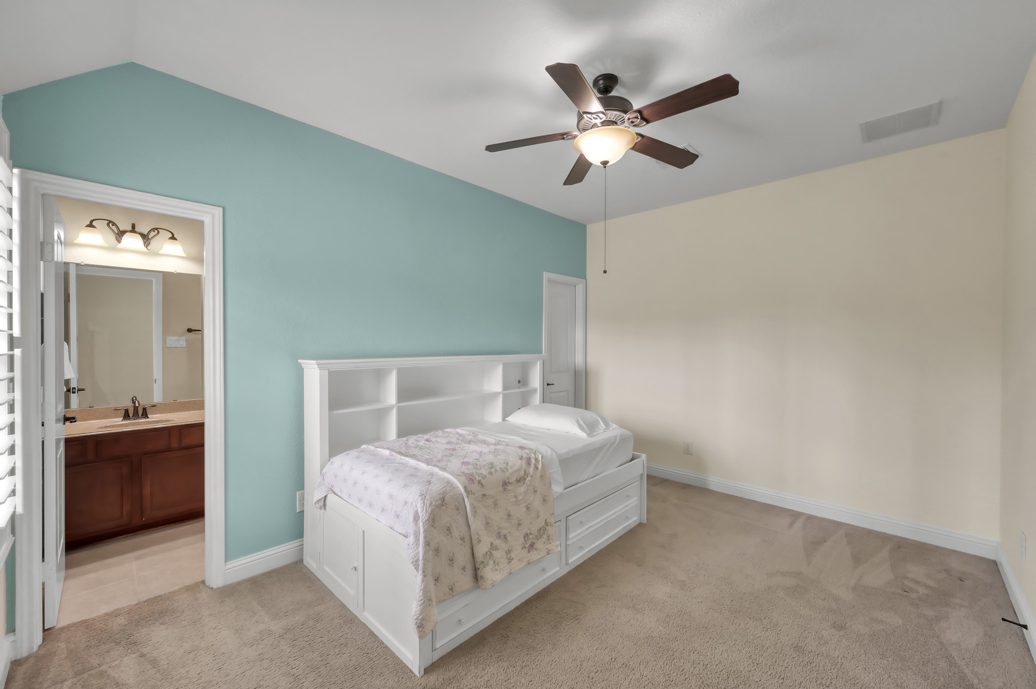 23 Rancher's Trail Tomball, TX 77375 - Photo 29 of 40 This inviting upstairs bedroom, one of three secondary rooms, offers the luxury of its own private bathroom, enhancing comfort and convenience for any homebuyer.