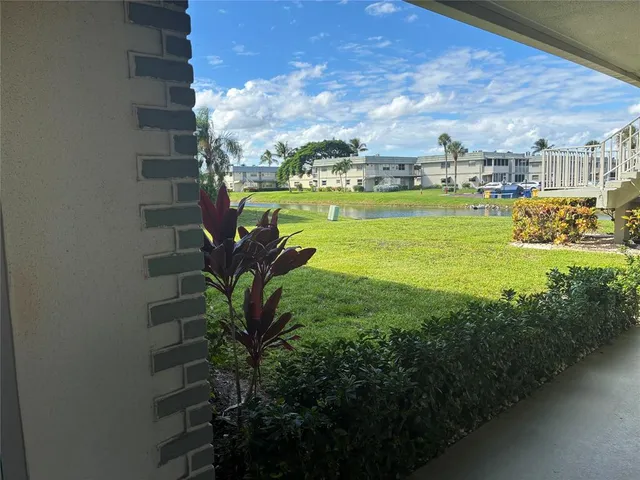 a view of a houses with a yard