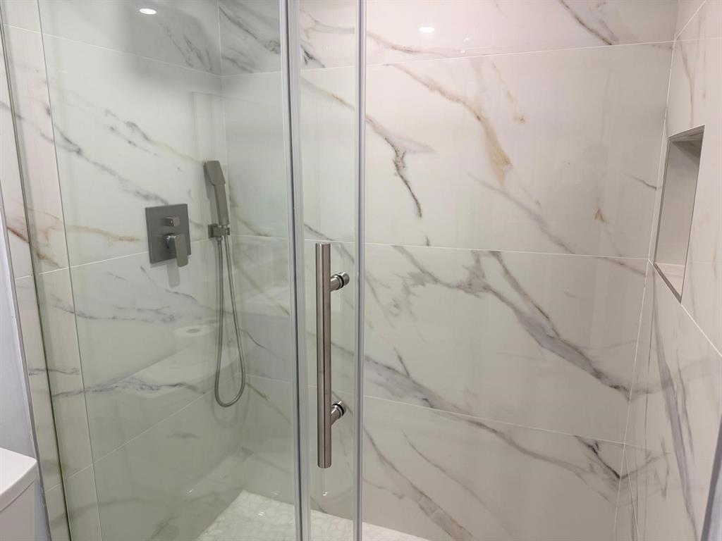 214 Monaco Boulevard, Unit 214 Delray Beach, FL 33446 - Photo 16 of 22 a bathroom with a shower