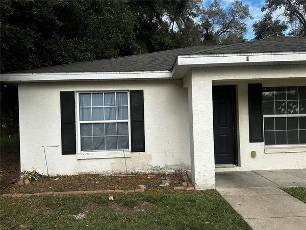 a house with trees in the background
