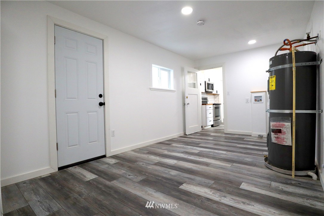 305 Fillmore Street Hoquiam, WA 98550 - Photo 13 of 23 a view of a kitchen with a sink and a refrigerator