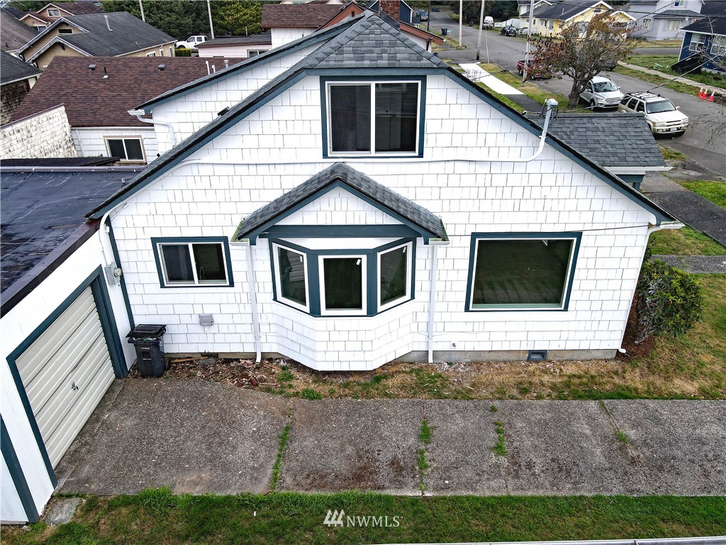 305 Fillmore Street Hoquiam, WA 98550 - Photo 21 of 23 a white house with tree in front of it