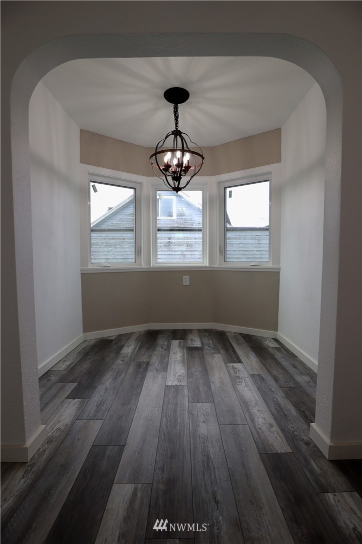 305 Fillmore Street Hoquiam, WA 98550 - Photo 8 of 23 wooden floor in an empty room with a window