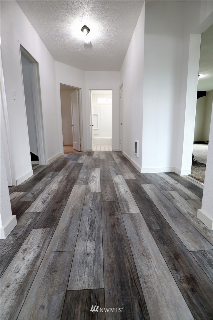 305 Fillmore Street Hoquiam, WA 98550 - Photo 10 of 23 a view of a room with wooden floor and staircase