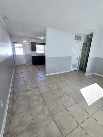 a view of entryway and kitchen