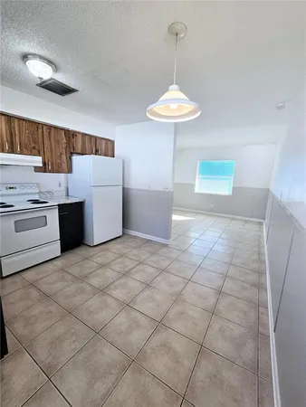 a kitchen with stainless steel appliances a sink and a cabinets