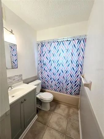 a bathroom with a toilet and a sink