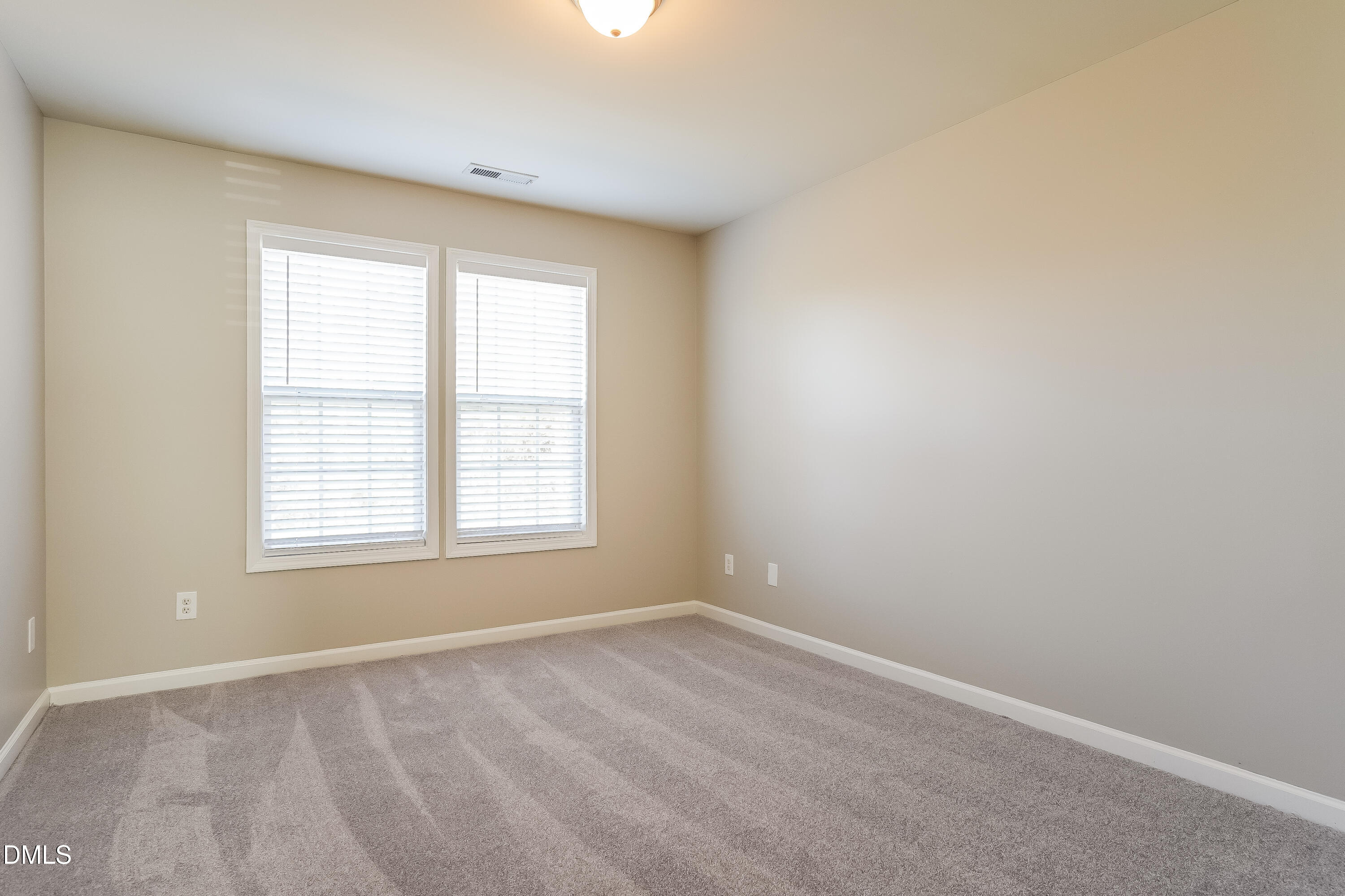 7109 Bristoe Station Lane Raleigh, NC 27610 - Photo 12 of 17 an empty room with a window