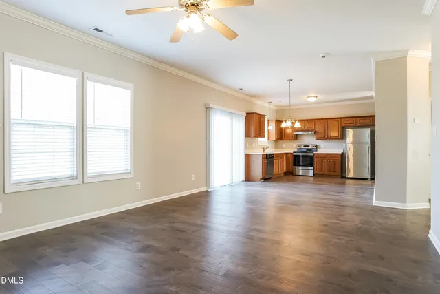 a view of a kitchen with a sink and a window