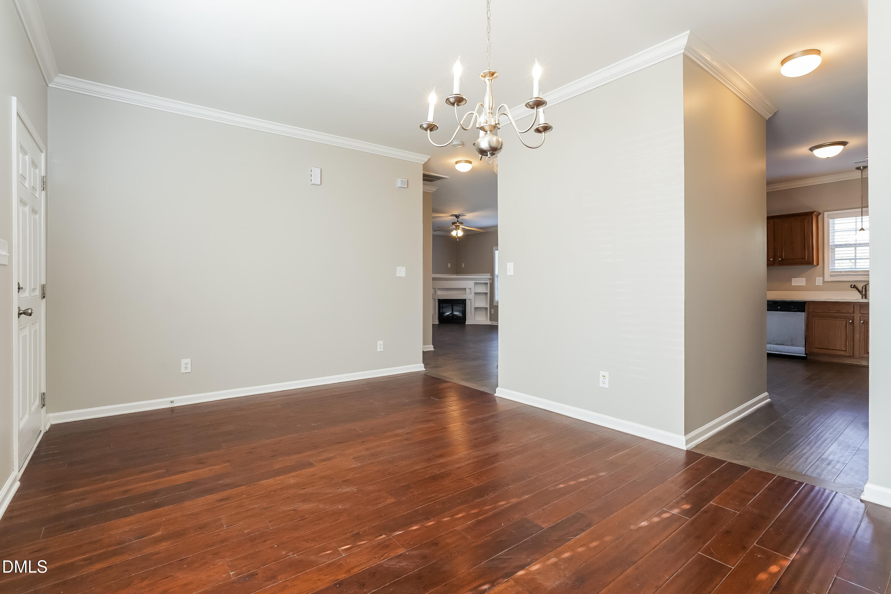 7109 Bristoe Station Lane Raleigh, NC 27610 - Photo 5 of 17 wooden floor in an empty room with a window