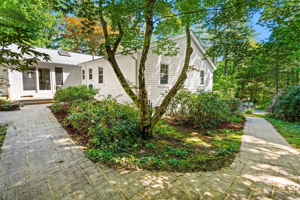 371 Longley Road Groton, MA 01450 - Photo 25 of 33 a front view of a house with a yard