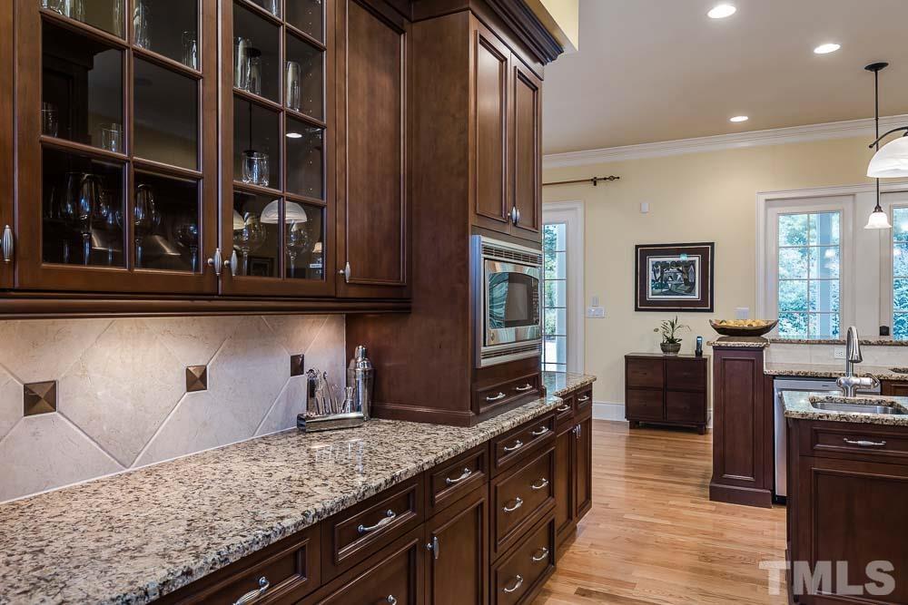 5204 Atherton Bridge Road Raleigh, NC 27613 - Photo 11 of 27 a kitchen with granite countertop lots of counter top space