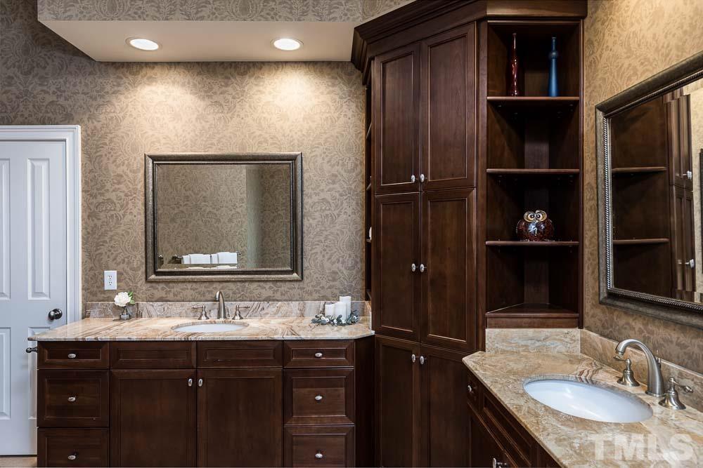 5204 Atherton Bridge Road Raleigh, NC 27613 - Photo 16 of 27 a bathroom with a granite countertop double vanity sink and a mirror