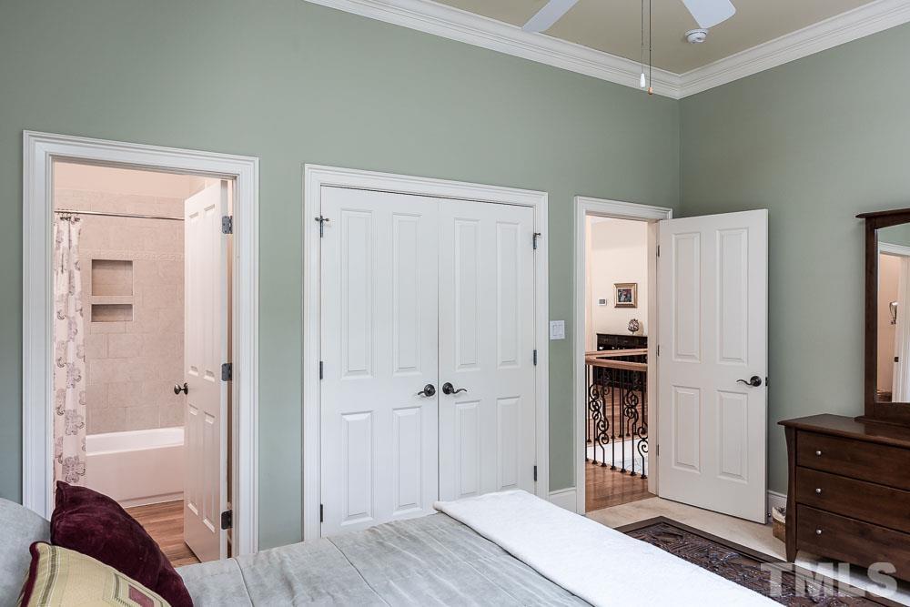 5204 Atherton Bridge Road Raleigh, NC 27613 - Photo 17 of 27 a bedroom with a bed and a closet