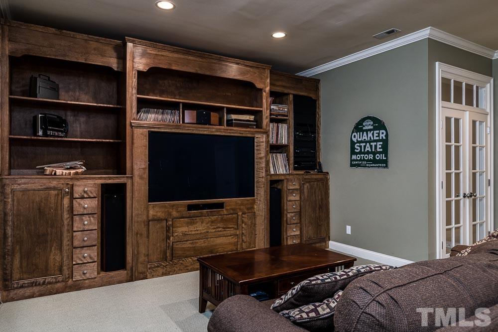 5204 Atherton Bridge Road Raleigh, NC 27613 - Photo 21 of 27 a bedroom with a bed and a television