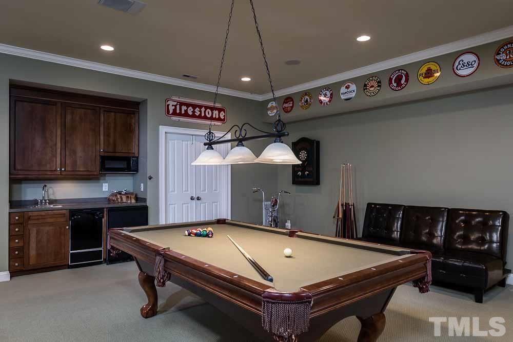 5204 Atherton Bridge Road Raleigh, NC 27613 - Photo 22 of 27 a room with pool table and a flat screen tv