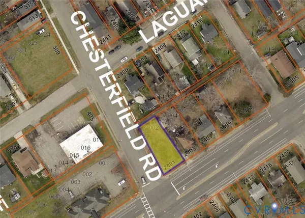 a view of a field with trees in the background