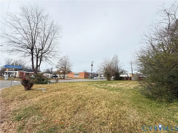 a view of a city street and trees