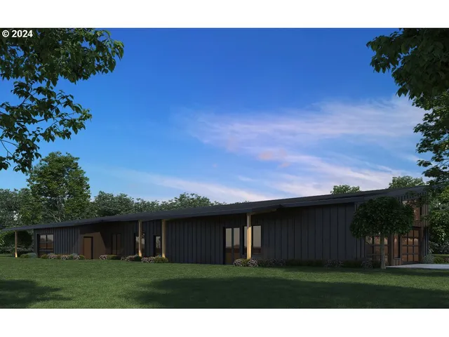 a view of house with backyard