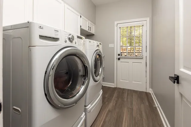 a view of bathroom with washer and dryer