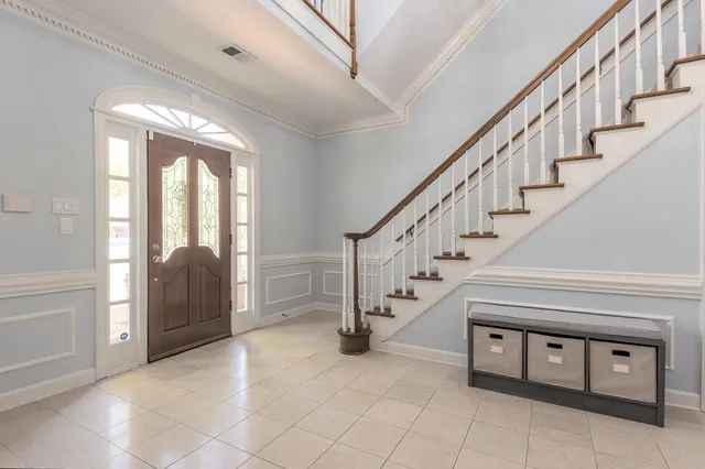 a view of entryway and hall with a front door