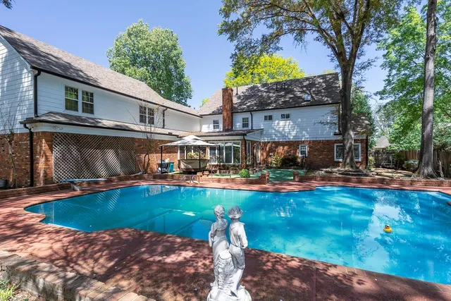 a view of a swimming pool with patio