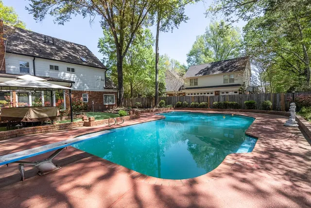 a view of a house with swimming pool