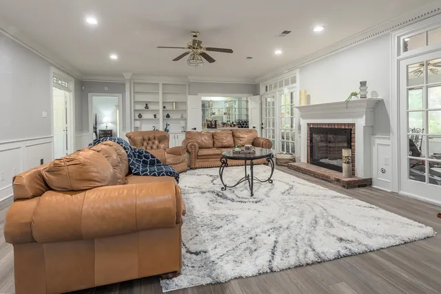 a living room with furniture and a fireplace
