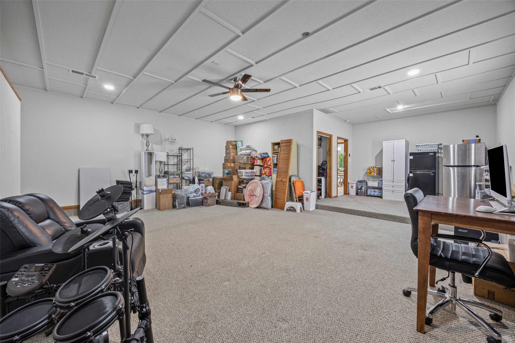 2000 Spinel Road Pflugerville, TX 78660 - Photo 21 of 31 A spacious lower-level entertainment area boasts soft carpeting and recessed lighting.
