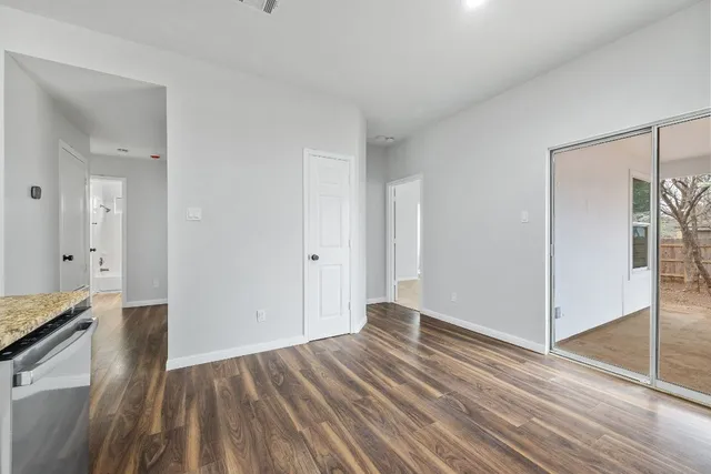 a view of livingroom with hardwood floor and hallway