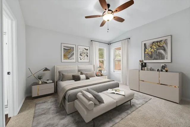 a living room with furniture and a ceiling fan