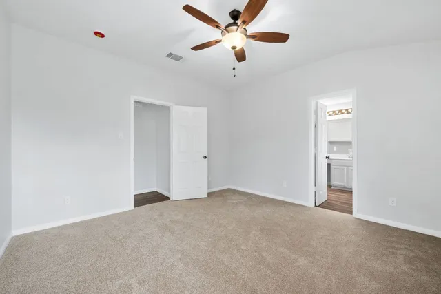 a view of a big room with carpet