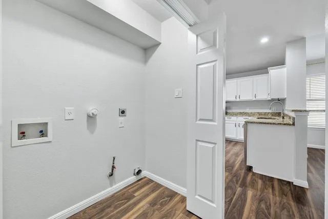 a view of kitchen with wooden floor